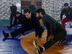 Congress leader Rahul Gandhi exercises with Olympian Bajrang Punia during his visit to the Virender Arya Akhara, in Jhajjar on Wednesday.