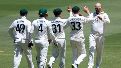 Australia's Nathan Lyon, right, is congratulated by teammates after taking the wicket of Pakistan's Imam-ul-Haq during the second day of their cricket test match in Melbourne (AP)