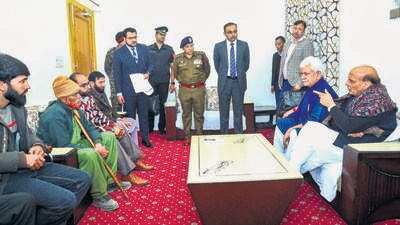 Defence minister Rajnath Singh meets families of the three men who were allegedly tortured in custody, in Poonch district of Jammu & Kashmir on Wednesday. (Defence spokesperson) Defence minister Rajnath Singh meets families of the three men who were allegedly tortured in custody, in Poonch district of Jammu & Kashmir on Wednesday. (Defence spokesperson)
