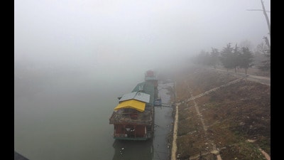 For the third consecutive day, dense fog affected life across parts of Kashmir on Wednesday. Residents woke up to find the Valley enveloped by a thick layer of fog which continued till noon when the conditions improved, and the atmosphere cleared up for some period. (Waseem Andrabi /HT) For the third consecutive day, dense fog affected life across parts of Kashmir on Wednesday. Residents woke up to find the Valley enveloped by a thick layer of fog which continued till noon when the conditions improved, and the atmosphere cleared up for some period. (Waseem Andrabi /HT)