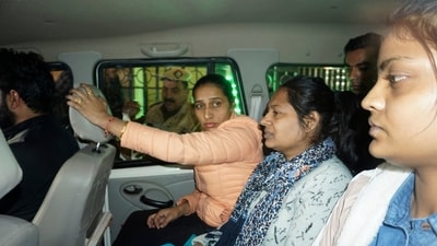 Neelam Azad, center, an accomplice in Wednesday's security breach in the Indian parliament. (AP) Neelam Azad, center, an accomplice in Wednesday's security breach in the Indian parliament. (AP)