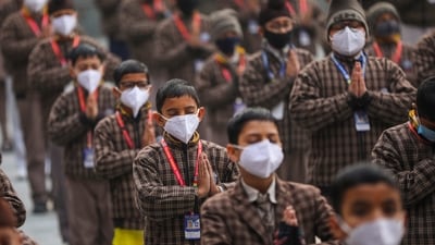 School students wear face masks during prayer amid rise in Covid-19 cases in the country, in Jammu on Friday (PTI) School students wear face masks during prayer amid rise in Covid-19 cases in the country, in Jammu on Friday (PTI)