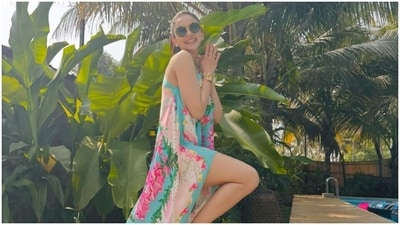 Another look from Rakul's getaway showed the actor dressed in a breezy slip-on dress, serving island vibes. She wore a floral patterned ensemble featuring a one-shoulder neckline, thigh-high slits on both sides, a high-low asymmetric hem, and an ill-fitted silhouette. (Instagram) Another look from Rakul's getaway showed the actor dressed in a breezy slip-on dress, serving island vibes. She wore a floral patterned ensemble featuring a one-shoulder neckline, thigh-high slits on both sides, a high-low asymmetric hem, and an ill-fitted silhouette. (Instagram)
