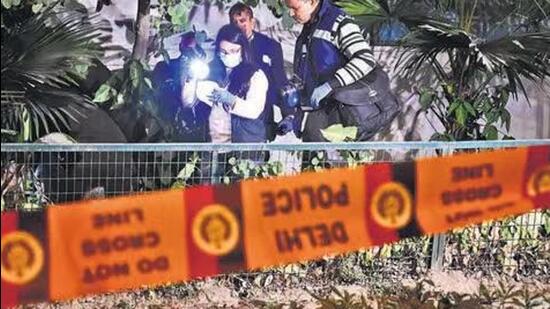 A forensic team inspects the area after a low-intensity blast at the Israel Embassy in New Delhi on Tuesday (HT Photo)