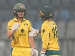 Australia's Ellyse Perry, left, celebrates after scoring 50 runs with her team player Phoebe Litchfield Australia's Ellyse Perry, left, celebrates after scoring 50 runs with her team player Phoebe Litchfield