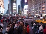 Tourists in the Times Square neighbourhood of New York, US. (Bloomberg)
