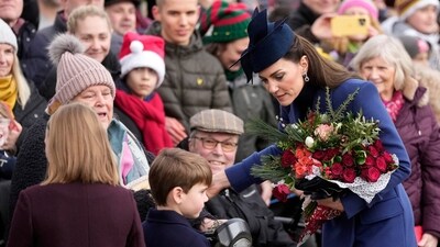 Britain's Kate, the Princess of Wales, and Prince Louis meet well-wishers after attending the Christmas day service at St Mary Magdalene Church. (AP) Britain's Kate, the Princess of Wales, and Prince Louis meet well-wishers after attending the Christmas day service at St Mary Magdalene Church. (AP)