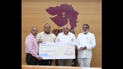 Donation of  ₹5 Crore was made by the Gujarat Government to Shivsrushti, at Ambegaon. While accepting the donation, in the photo (from Left) Vineet Kuber, Sandeep Jadhav, Bhupendra Patel and Mulu Bera. (HT PHOTO)