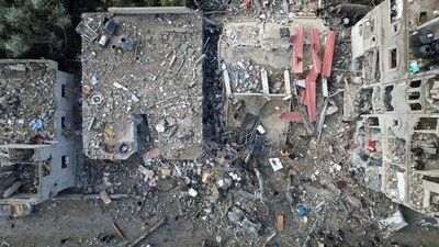 Israel-Hamas War: Palestinians gather at the site of Israeli strikes on houses, amid the ongoing conflict between Israel and Hamas. (Reuters)