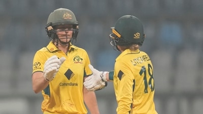 Australia's Ellyse Perry, left, celebrates after scoring 50 runs with her team player Phoebe Litchfield (AP) Australia's Ellyse Perry, left, celebrates after scoring 50 runs with her team player Phoebe Litchfield (AP)
