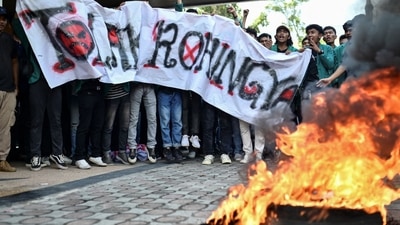 Indonesian protesters burn a tire during a protest for the deportation of the Rohingya refugees in Banda Aceh. (Reuters)