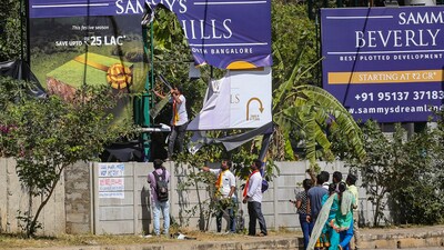 Karnataka Rakshana Vedike activists pulling down a signboard on Wednesday in Bengaluru as it did not have 60% Kannada. (PTI) Karnataka Rakshana Vedike activists pulling down a signboard on Wednesday in Bengaluru as it did not have 60% Kannada. (PTI)