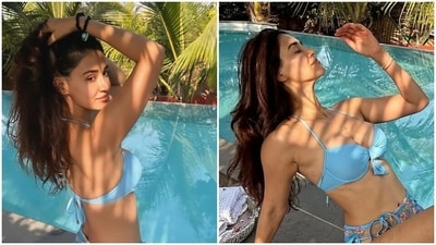 Disha Patani posts poolside pictures in a blue bikini and a floral sarong. (Instagram) Disha Patani posts poolside pictures in a blue bikini and a floral sarong. (Instagram)