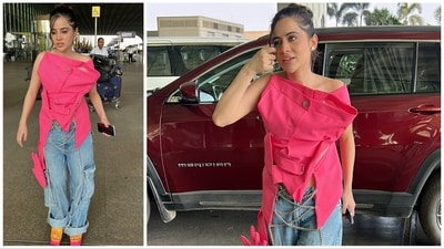 Uorfi Javed was spotted at the Mumbai airport on Thursday in a yet another experimental outfit. She wore denims paired with a top made of pink pants wrapped around in a unique fashion. Uorfi Javed was spotted at the Mumbai airport on Thursday in a yet another experimental outfit. She wore denims paired with a top made of pink pants wrapped around in a unique fashion. 