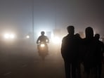 Traffic plies on a highway amidst dense evening fog on the outskirts of Amritsar on Thursday. (ANI Photo)