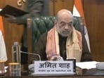 Union home minister Amit Shah signing the agreement. Union home minister Amit Shah signing the agreement.