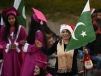 Christians devotees take part in a parade along a road ahead Christmas celebrations, in Islamabad on December on December 5, 2023. Christians devotees take part in a parade along a road ahead Christmas celebrations, in Islamabad on December on December 5, 2023.