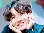 Laughter booms out as the two share a light-hearted moment, with Jhope jokingly expressing the challenges of having hair trimmings end up in his mouth. Laughter booms out as the two share a light-hearted moment, with Jhope jokingly expressing the challenges of having hair trimmings end up in his mouth.