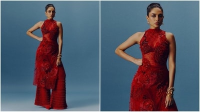Her all red look consisted of a halter neck kurta in translucent fabric embellished with floral embroidery and silver shimmering detailing all over. She paired it with a matching red flared pant. Accessorised with gold hoop earrings and stacked bracelets, she completed the look. (Instagram/@sobhitad)