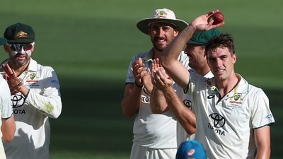 Australia's Pat Cummins, right, hold up the ball after taking 5 wickets against Pakistan during Day 4. (AP) Australia's Pat Cummins, right, hold up the ball after taking 5 wickets against Pakistan during Day 4. (AP)