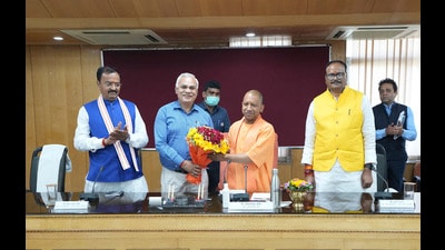 Chief Secretary of Uttar Pradesh Durga Shankar Mishra presents a bouquet of flowers to Uttar Pradesh Chief Minister Yogi Adityanath on his first day after taking the oath of office, with Deputy Chief Ministers Brijesh Pathak, right, and Keshav Prasad Maurya, left, standing beside him in Lucknow on March 26, 2022. (AP Photo/Rajesh Kumar Singh) (AP File Photo) Chief Secretary of Uttar Pradesh Durga Shankar Mishra presents a bouquet of flowers to Uttar Pradesh Chief Minister Yogi Adityanath on his first day after taking the oath of office, with Deputy Chief Ministers Brijesh Pathak, right, and Keshav Prasad Maurya, left, standing beside him in Lucknow on March 26, 2022. (AP Photo/Rajesh Kumar Singh) (AP File Photo)