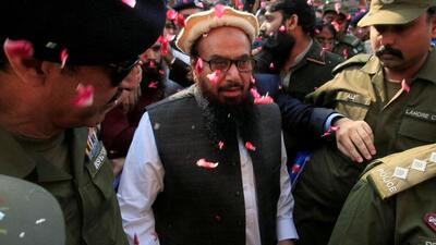 FILE PHOTO: Hafiz Saeed is showered with flower petals as he walks to court before a Pakistani court ordered his release from house arrest in Lahore on November 22, 2017 (REUTERS) FILE PHOTO: Hafiz Saeed is showered with flower petals as he walks to court before a Pakistani court ordered his release from house arrest in Lahore on November 22, 2017 (REUTERS)