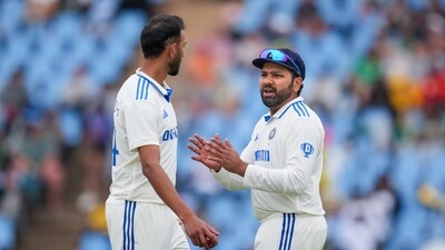 India's captain Rohit Sharma with bowler Prasidh Krishna (PTI) India's captain Rohit Sharma with bowler Prasidh Krishna (PTI)