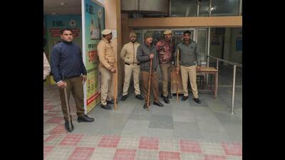 Policemen stand guard at the civil hospital in Karnal after government doctors struck work in support of their demands on Friday. (HT Photo) Policemen stand guard at the civil hospital in Karnal after government doctors struck work in support of their demands on Friday. (HT Photo)