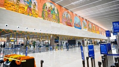 A view from inside the Maryada Purushottam Shri Ram International Airport in Ayodhya. On the top one can see paintings depicting Lord Shri Ram's life while looking down one can spot the elaborate arrangements made ahead of its inauguration on Saturday. Bag drop signages are kept at one spot whereas the area leading to security check-ins is also organised. (ANI)