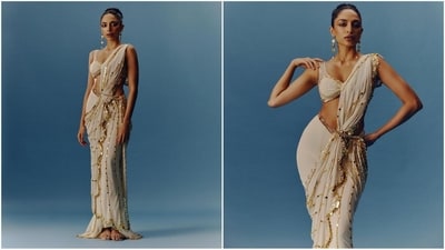 Sobhita's ethnic diaries are definitely serving saree goals with another breathtaking saree look that featured an off-white plunging neckline bralette blouse adorned with silver sequin embroidery. Her saree with intricate gown embroidery all over was draped on the shoulders and the addition of a gold chain belt made it a complete showstopper. (Instagram/@sobhitad)