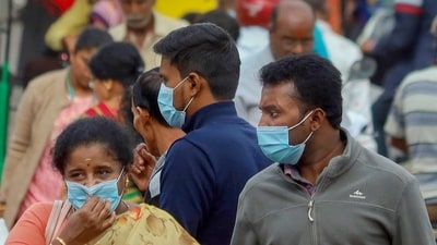 People wearing face masks as a precautionary measure after cases of COVID-19 sub-variant JN.1 detected in the country. (PTI) People wearing face masks as a precautionary measure after cases of COVID-19 sub-variant JN.1 detected in the country. (PTI)