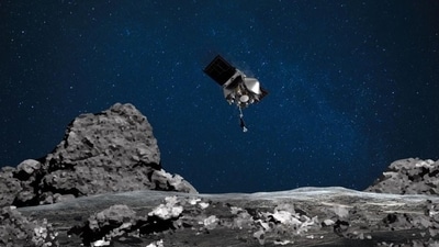 An artist's rendering of the OSIRIS-REx spacecraft descending towards asteroid Bennu to collect a sample of the asteroid’s surface. (AFP File Photo) An artist's rendering of the OSIRIS-REx spacecraft descending towards asteroid Bennu to collect a sample of the asteroid’s surface. (AFP File Photo)
