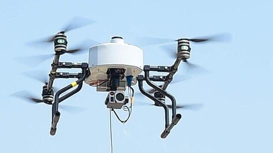 Ahmedabad Crime Branch police operates a tethered drone outside the Narendra Modi Stadium in Ahmedabad on October 13 (AFP File Photo)