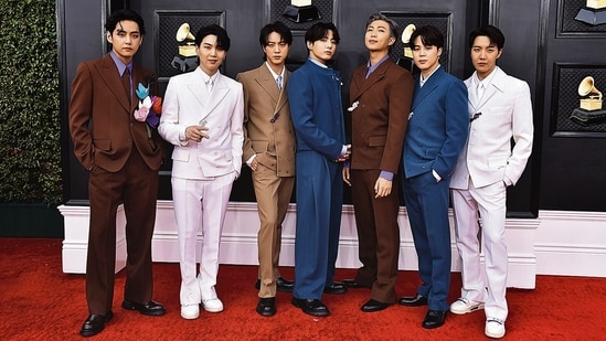 BTS members V, Suga, Jin, Jungkook, RM, Jimin and J-Hope at an event.
