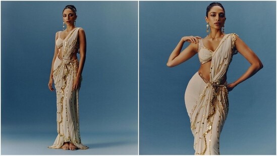 Sobhita's ethnic diaries are definitely serving saree goals with another breathtaking saree look that featured an off-white plunging neckline bralette blouse adorned with silver sequin embroidery. Her saree with intricate gown embroidery all over was draped on the shoulders and the addition of a gold chain belt made it a complete showstopper.(Instagram/@sobhitad)