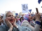 Women shout slogans during a protest for climate justice and a cease fire in Gaza, amid the ongoing conflict between Israel and the Palestinian Islamist group Hamas, during the United Nations Climate Change Conference COP28, in Dubai, United Arab Emirates, December 9, 2023. REUTERS/Amr Alfiky