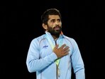 Gold Medallist India's Bajrang Punia celebrates on the podium during the medal ceremony 
