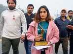 Wrestler Vinesh Phogat walks with her Arjuna and Khel Ratna Awards. She kept the awards at Kartavya Path on Saturday.