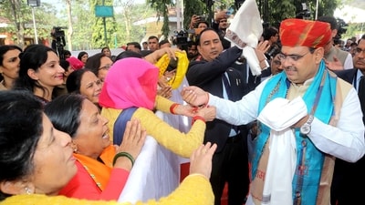 Rajasthan Chief Minister Bhajan Lal Sharma being greeted by the beneficiaries during the distribution of gas cylinders to Below Poverty Line (BPL) families and Ujjwala Scheme beneficiaries. (Ashok Sharma) Rajasthan Chief Minister Bhajan Lal Sharma being greeted by the beneficiaries during the distribution of gas cylinders to Below Poverty Line (BPL) families and Ujjwala Scheme beneficiaries. (Ashok Sharma)