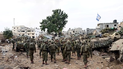 Israeli soldiers operate at the Shajaiya district of Gaza city amid the ongoing conflict between Israel and the Palestinian Islamist group Hamas, in the Gaza Strip December 8, 2023. (REUTERS)