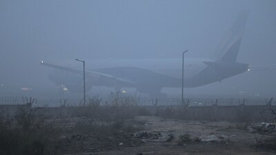 Passenger aircraft wait at the taxiway to takeoff in a thick layer of fog at Terminal 3 of IGI Airport, in New Delhi. (Vipin Kumar/ HT) Passenger aircraft wait at the taxiway to takeoff in a thick layer of fog at Terminal 3 of IGI Airport, in New Delhi. (Vipin Kumar/ HT)