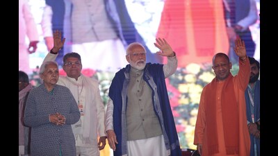 Prime Minister Narendra Modi along with Uttar Pradesh governor Anandiben Patel and chief minister Yogi Adityanath wave their hands to the crowed during rally at Maharshi Valmiki International Airport in Ayodhya, Uttar Pradesh India on Saturday December 30, 2023. (Deepak Gupta/Hindustan Times) Prime Minister Narendra Modi along with Uttar Pradesh governor Anandiben Patel and chief minister Yogi Adityanath wave their hands to the crowed during rally at Maharshi Valmiki International Airport in Ayodhya, Uttar Pradesh India on Saturday December 30, 2023. (Deepak Gupta/Hindustan Times)