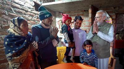 Prime Minister Narendra Modi visits the house of an Ujjwala Yojana beneficiary, in Ayodhya (PTI)