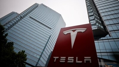 A Tesla logo is seen outside a showroom of the carmaker in Beijing, China. (REUTERS)
