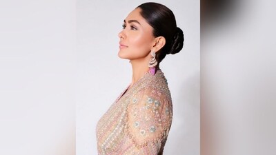 With the help of hairstylist Deepali Deokar, Mrunal styled her lush locks into a neat bun that perfectly complemented her stunning ethnic look and turned her into a stylish showstopper. (Instagram/@mrunalthakur) With the help of hairstylist Deepali Deokar, Mrunal styled her lush locks into a neat bun that perfectly complemented her stunning ethnic look and turned her into a stylish showstopper. (Instagram/@mrunalthakur)