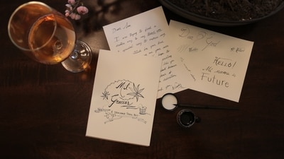 Write a card: You can make the most basic gift more meaningful with a handwritten card. If you have enough time, you can design your own online with photos of you together. (Unsplash/Wendy Aros-Routman)