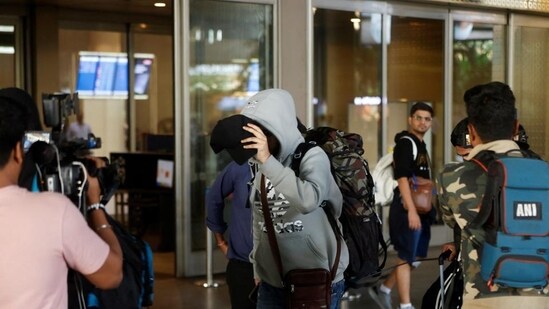 A person, who was on board Nicaragua-bound flight grounded in France on suspicion of human trafficking, evades the media as he leaves the Mumbai airport. (REUTERS) (Representative Image)