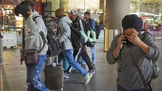 Passengers of a chartered plane, which was grounded in France for four days over suspected human trafficking, arrived in Mumbai on December 26. (PTI Photo)