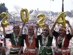 Shimla: Girls in traditional Himachali attire hold balloons to form 2024 during New Year celebrations, in Shimla, Sunday, Dec. 31, 2023. (PTI Photo)(PTI12_31_2023_000072B) Shimla: Girls in traditional Himachali attire hold balloons to form 2024 during New Year celebrations, in Shimla, Sunday, Dec. 31, 2023. (PTI Photo)(PTI12_31_2023_000072B)