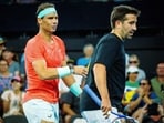 Spain's Rafael Nadal (L) and partner Marc Lopez are seen during their men's doubles match against Australia's Max Purcell and Jordan Thompson at the Brisbane International tennis tournament in Brisbane on December 31